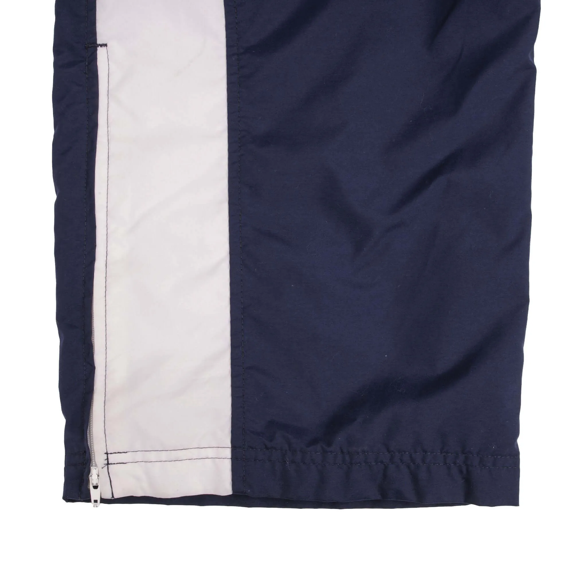 VINTAGE NIKE WHITE AND BLUE NYLON TRACK PANTS 2000S SIZE LARGE