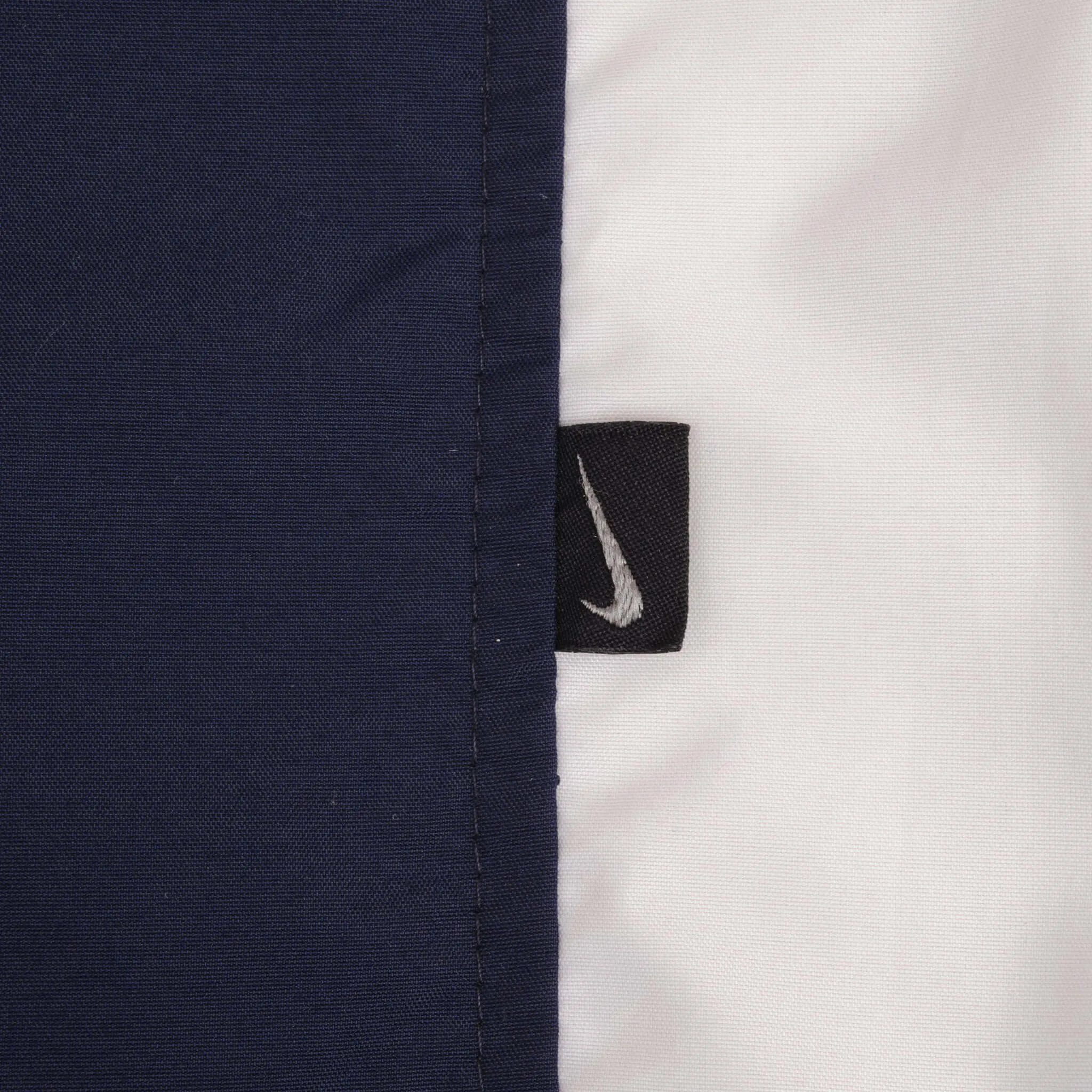 VINTAGE NIKE WHITE AND BLUE NYLON TRACK PANTS 2000S SIZE LARGE