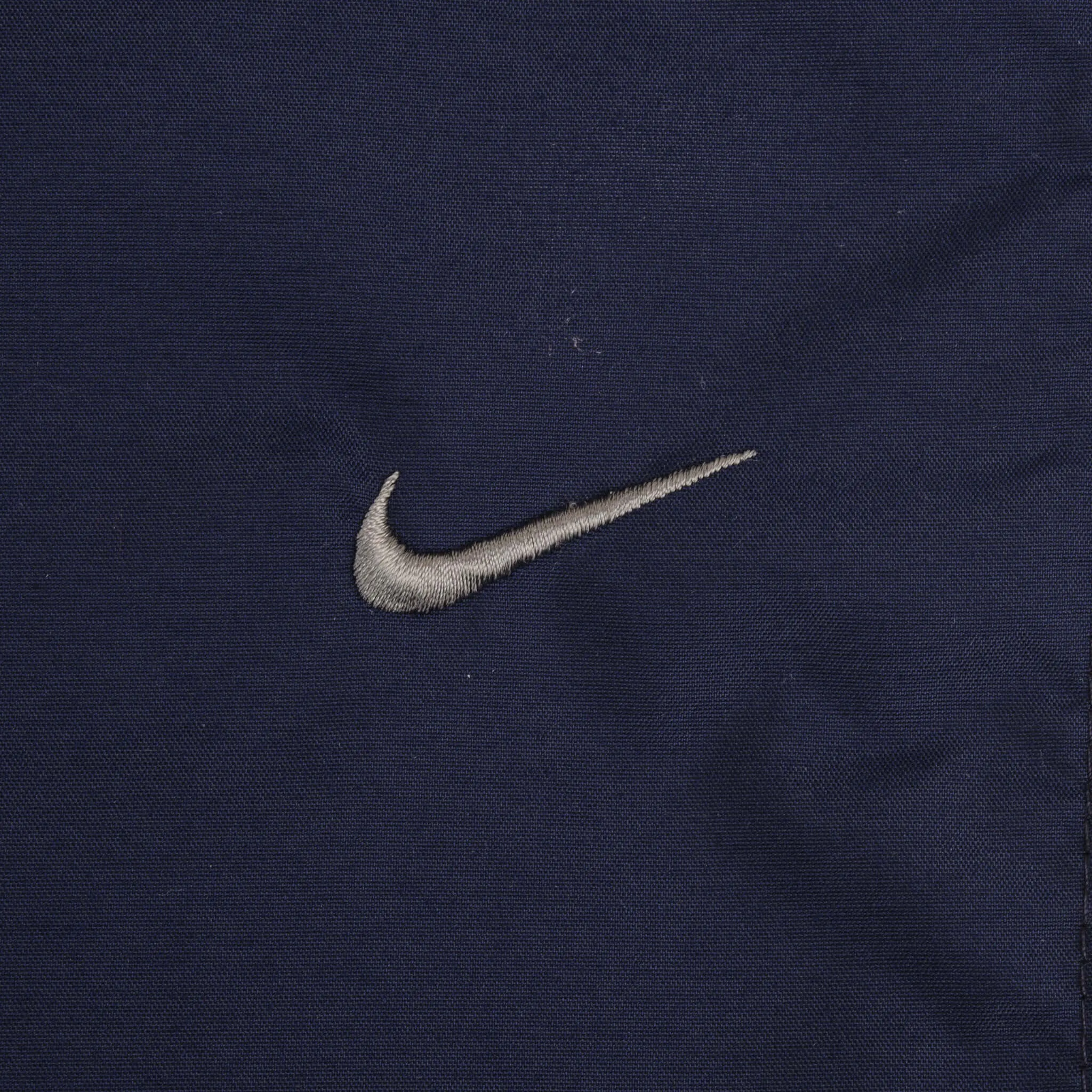 VINTAGE NIKE WHITE AND BLUE NYLON TRACK PANTS 2000S SIZE LARGE
